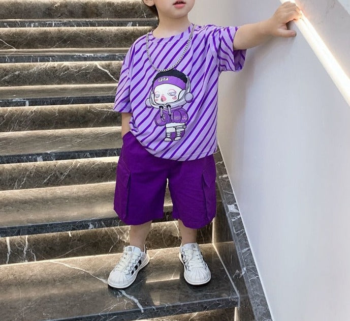 Image of a boy wearing a trendy Hiphop Shirt made from a comfortable blend of cotton and polyester. Available in stylish blue and red colors in various sizes, perfect for boys aged 1 to 12 years old. This shirt can be paired with their favorite rubber shoes for the ultimate cool and comfortable look. Order now and make your boys the coolest kids in school!