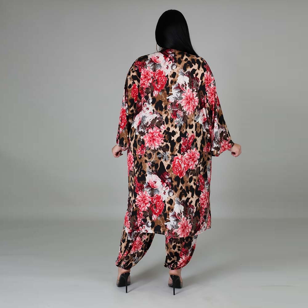 A 3-Piece Floral Set made of polyester with a stretchy waist that can be worn all year round. Perfect for the fall season, this outfit is easy to put together and take off. The set includes a long sleeve coat, sleeveless top, and pants that can be worn separately. Stay comfortable and stylish with this versatile ensemble!