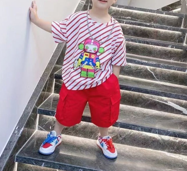 Image of a boy wearing a trendy Hiphop Shirt made from a comfortable blend of cotton and polyester. Available in stylish blue and red colors in various sizes, perfect for boys aged 1 to 12 years old. This shirt can be paired with their favorite rubber shoes for the ultimate cool and comfortable look. Order now and make your boys the coolest kids in school!