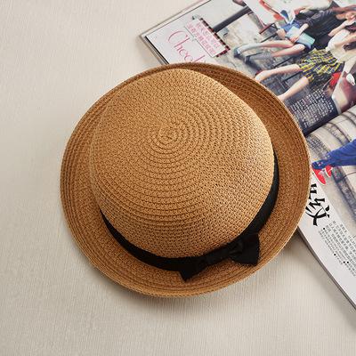 Stylish and durable summer beach hat made of straw and paper. Perfect for protecting you from the sun's heat while looking fashionable.