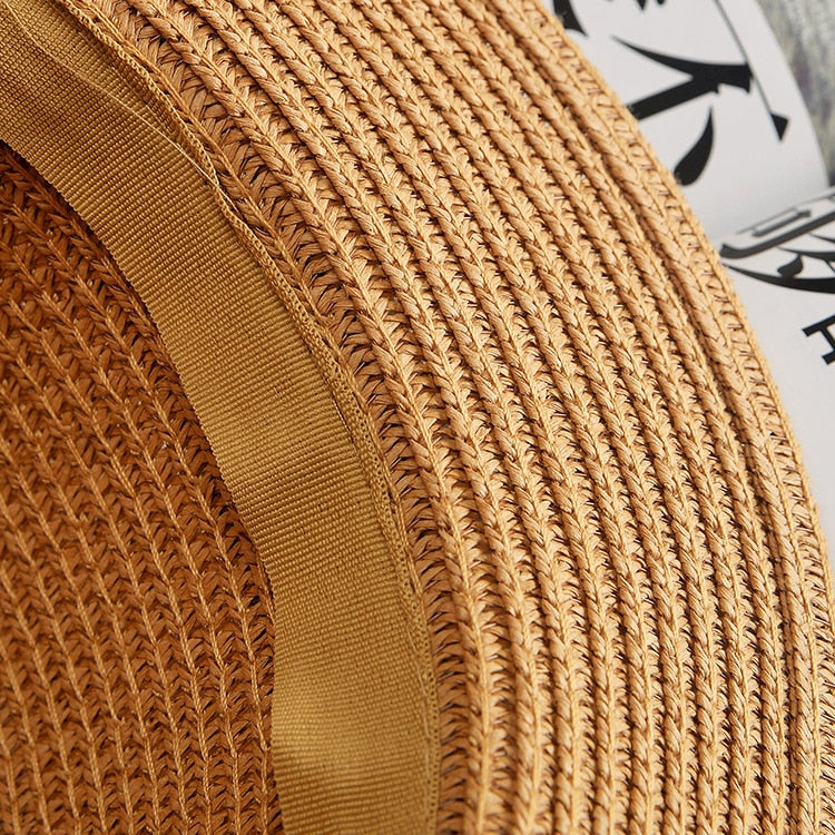 Stylish and durable summer beach hat made of straw and paper. Perfect for protecting you from the sun's heat while looking fashionable.