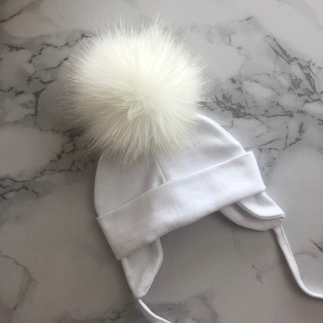 Organic & Hypoallergenic Baby Beanies | Super-Soft & Gentle on Newborn Skin | Variety of Colors & Patterns | Pom-Topped Cable-Knit Design | Shop Now!