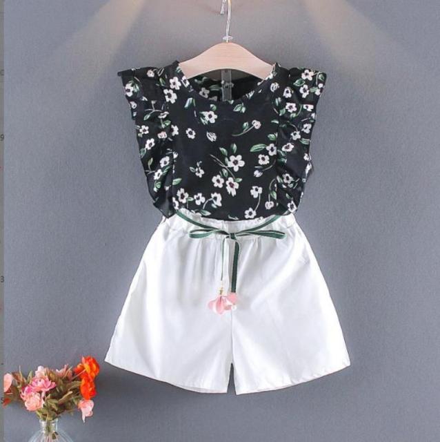 Image of Cute 2-Piece Summer Outfit - Stylish and comfortable summer outfit for girls. Includes a colorful tank top with short sleeves and elastic waistband shorts. Perfect for everyday summer wear. Pair with sandals or flip flops for an adorable look!