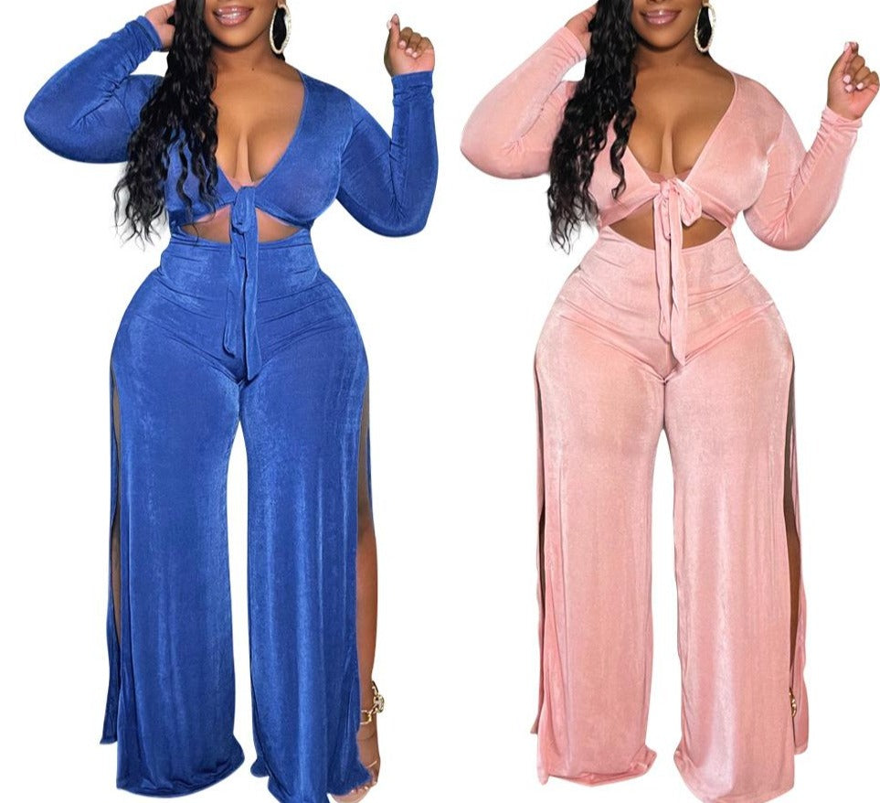 A 2-Piece Classy Tracksuit perfect for fall, featuring a long sleeve top and wide-leg pants. Trendy, classy, and sexy with a plunging neckline and slits on both sides of the pants. Available in blue and pink and in different sizes to fit you perfectly. Ideal for dates, parties, and other casual occasions. Switch up your style this fall and get yours now!