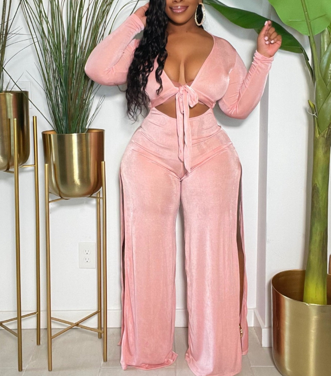 A 2-Piece Classy Tracksuit perfect for fall, featuring a long sleeve top and wide-leg pants. Trendy, classy, and sexy with a plunging neckline and slits on both sides of the pants. Available in blue and pink and in different sizes to fit you perfectly. Ideal for dates, parties, and other casual occasions. Switch up your style this fall and get yours now!