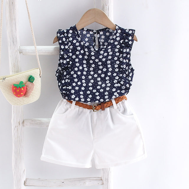 Image of Cute 2-Piece Summer Outfit - Stylish and comfortable summer outfit for girls. Includes a colorful tank top with short sleeves and elastic waistband shorts. Perfect for everyday summer wear. Pair with sandals or flip flops for an adorable look!