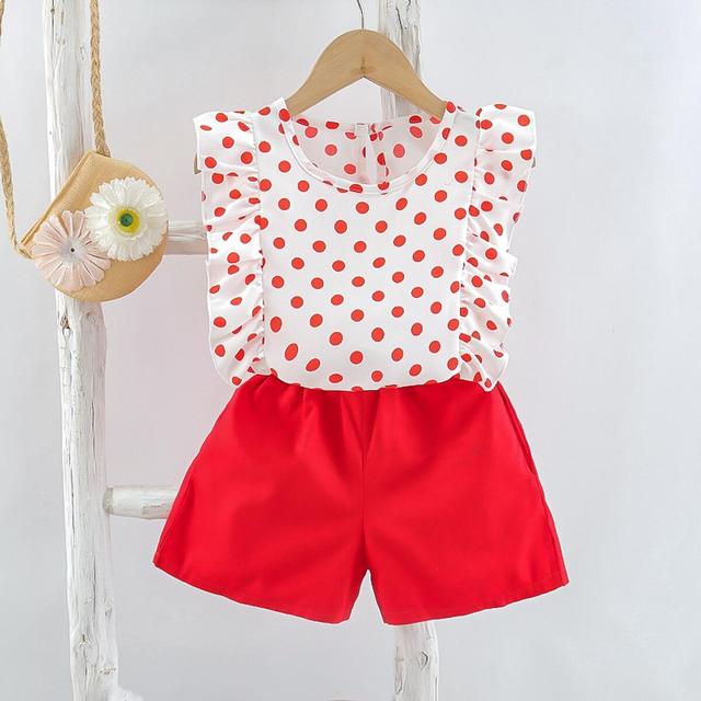 Image of Cute 2-Piece Summer Outfit - Stylish and comfortable summer outfit for girls. Includes a colorful tank top with short sleeves and elastic waistband shorts. Perfect for everyday summer wear. Pair with sandals or flip flops for an adorable look!