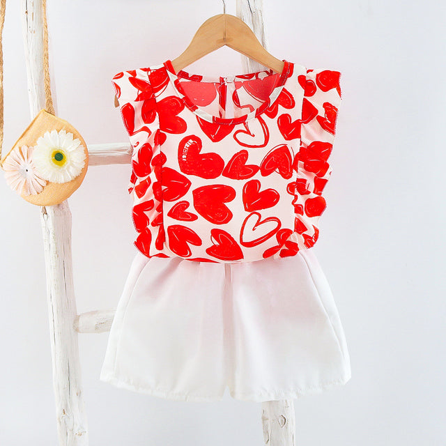 Image of Cute 2-Piece Summer Outfit - Stylish and comfortable summer outfit for girls. Includes a colorful tank top with short sleeves and elastic waistband shorts. Perfect for everyday summer wear. Pair with sandals or flip flops for an adorable look!